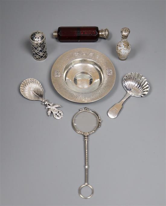 A 1970s silver commemorative dish, a Georgian silver caddy spoon, Dutch caddy spoons and other items.